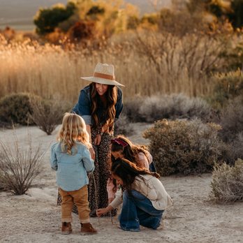 Sheenagal Photography - backlit image of mother interacting with her children in some tall grass - Session Photography Near Me - Las Vegas, Nevada Sheenagal Photography - backlit image of mother interacting with her children in some tall grass - Session Photography Near Me - Las Vegas, Nevada