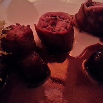 Mignon - Bacon Wrapped Quail, Savory Bread Pudding, Cherries - Steakhouses Near Me - Plano, Texas