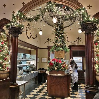 The Keg Steakhouse + Bar - Interior during holiday season - decked out with Christmas trees and festive decorations - Steakhouses Near Me - Toronto, Ontario