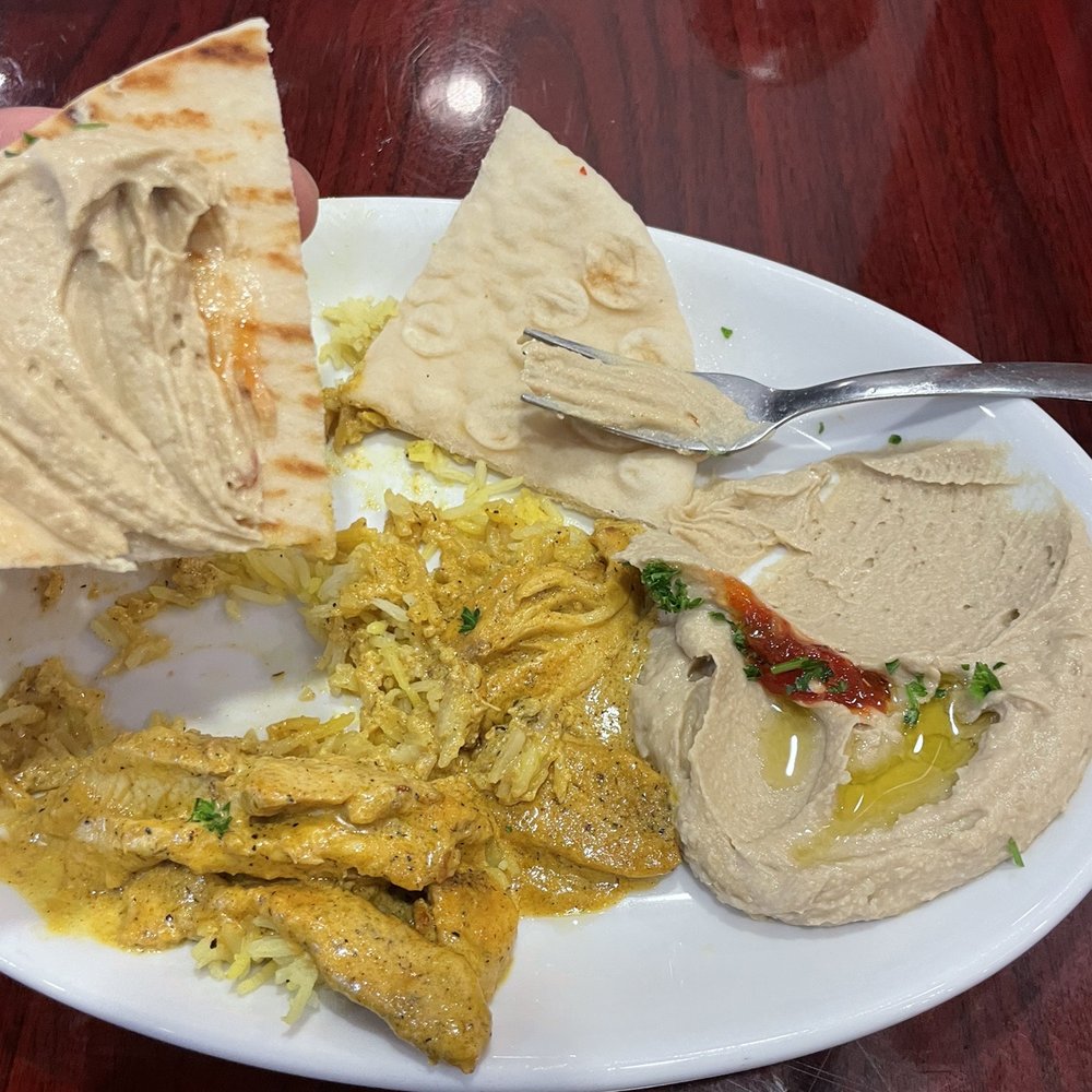 Zaina - Chicken curry With hummus and rice - Mediterranean Near Me - Kansas City, Missouri Zaina - Chicken curry With hummus and rice - Mediterranean Near Me - Kansas City, Missouri