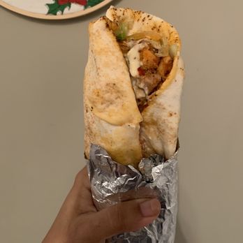 Amean Pizza Donair & Sub - a hand holding a burrito - Pizza Near Me - Edmonton, Alberta Amean Pizza Donair & Sub - a hand holding a burrito - Pizza Near Me - Edmonton, Alberta
