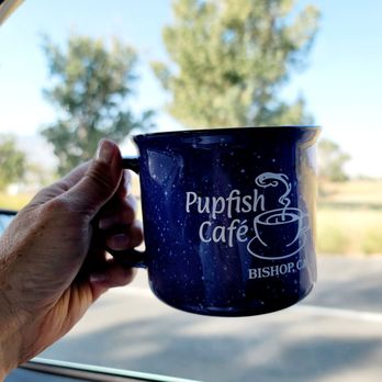Pupfish Cafe - a hand holding a cup of coffee - Coffee & Tea Near Me - Bishop, California