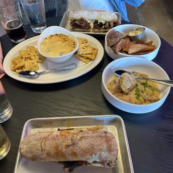 Little Lucy - Collard green and artichoke dip, brisket sandwich, catfish po boy, potato wedges and toasted ravioli. - Diners Near Me - St. Louis, Missouri Little Lucy - Collard green and artichoke dip, brisket sandwich, catfish po boy, potato wedges and toasted ravioli. - Diners Near Me - St. Louis, Missouri