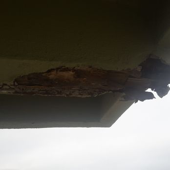 Surfer Beach Hotel - Looking at the balcony from below. The whole thing is cracked and very unsafe. - San Diego, CA