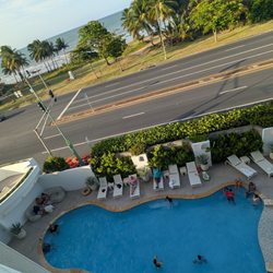 Comfort Inn & Suites - Room with a balcony overlooking pool and view of the beach across the street