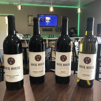 Rock House Vineyard - three bottles of wine on a table - Wine Tasting Room Near Me - Bennington, Oklahoma