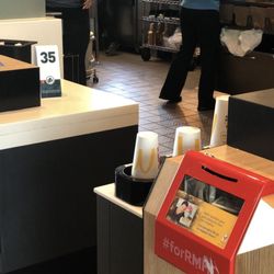 McDonald's - ONAYA is in the grey and manager who allowed her to keep working as she laughed at the entire ordeal is in the blue