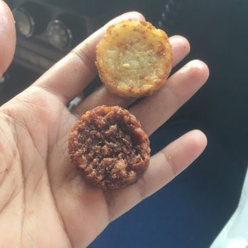 Dunkin' - Burned hash brown next to a normal looking one. How can you serve this especially when you only give like 4 or 5 of them. - Donuts Near Me - Hodgkins, Illinois