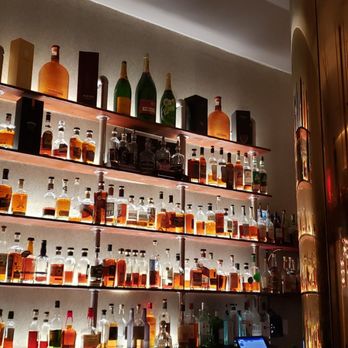 Bourbon N' Bubbles -  wall of liquor bottles - Bars Near Me - Charleston, South Carolina