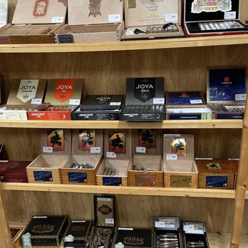 West Ash Cigar’s - a shelf full of cigars - Vape Shops Near Me - Charleston, South Carolina West Ash Cigar’s - a shelf full of cigars - Vape Shops Near Me - Charleston, South Carolina