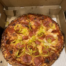Custom Pizza Anyway with pepperoni and double banana peppers with sriracha crust, cooked "well done but not burned". Delicious!
