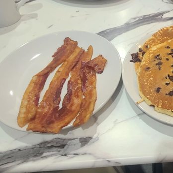 Kraves Pizza & Restaurant - Chocolate chip pancakes with a side of bacon. - Italian Near Me - Denville, New Jersey Kraves Pizza & Restaurant - Chocolate chip pancakes with a side of bacon. - Italian Near Me - Denville, New Jersey