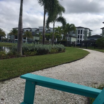 The Addison on Long Bayou - Walking path around fountain pond. - Apartments Near Me - Seminole, Florida The Addison on Long Bayou - Walking path around fountain pond. - Apartments Near Me - Seminole, Florida