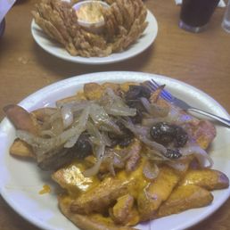 Loaded fries with added onions and mushrooms. Loaded fries with added onions and mushrooms.