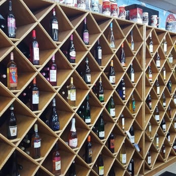 Sam's Beer Beer - a wall of wine bottles - Tobacco Shops Near Me - Flint, Michigan