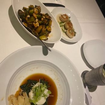 Eddie V's Prime Seafood - Chilean Sea Bass, Georges Bank Scallops Honey Sriracha Roasted Brussels Sprouts with Cashews - Seafood Near Me - Plano, Texas Eddie V's Prime Seafood - Chilean Sea Bass, Georges Bank Scallops Honey Sriracha Roasted Brussels Sprouts with Cashews - Seafood Near Me - Plano, Texas