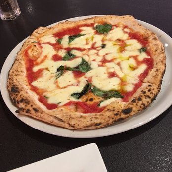 Pangea Kitchen - Margherita pizza fresh out of the oven - Pizza Near Me - Evansville, Indiana Pangea Kitchen - Margherita pizza fresh out of the oven - Pizza Near Me - Evansville, Indiana