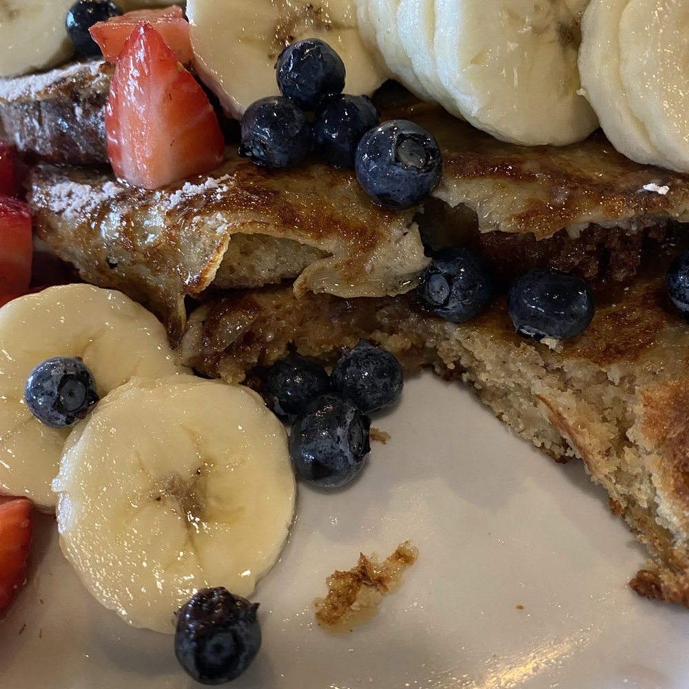 Batter Up Pancakes - Banana Bread French Toast. It comes with Banana slices, Strawberries and Blueberries. It's so delicious it really doesn't need syrup. - Pancakes Near Me - Clovis, California Batter Up Pancakes - Banana Bread French Toast. It comes with Banana slices, Strawberries and Blueberries. It's so delicious it really doesn't need syrup. - Pancakes Near Me - Clovis, California