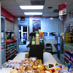 Mobil - inside the convenience store with ATM, coffee and sugary and fatty snacks, some peanuts, and some baked goods