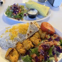 Hummus appetizer  and chicken kabob plate