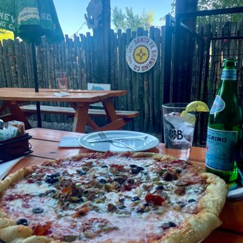 Taos Pizza Out Back - The Bottom Line pizza - Italian Near Me - Taos, New Mexico Taos Pizza Out Back - The Bottom Line pizza - Italian Near Me - Taos, New Mexico