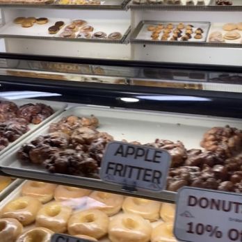 Pastry Perfection - a variety of donuts in a display case - Bakeries Near Me - Garden City, Idaho