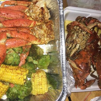 149 Steam Fish - Snow crab legs corn broccoli and a half dozen of blue crabs seasoned with old bay garlic & butter - Seafood Near Me - Bronx, New York