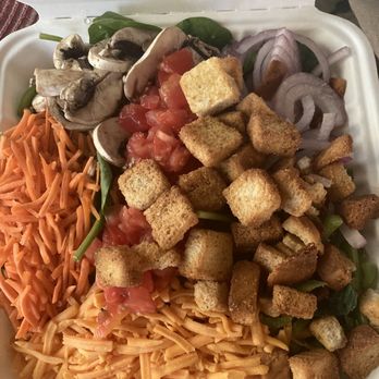 Gumby's Pizza - $7.49 spinach salad was surprisingly generous. Bell pepper hiding at bottom right corner. Included 1 packet of salad dressing. AUG23 - Pizza Near Me - San Marcos, Texas