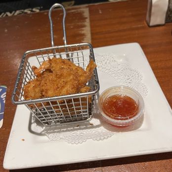 Celtic Pub Restaurant - a basket of fried chicken with a side of ketchup - Irish Pub Near Me - New York, New York