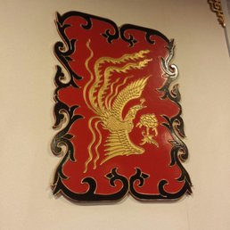 a red and gold dragon on the wall a red and gold dragon on the wall
