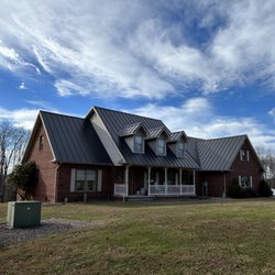 Stone House Construction - Matte Black Standing Seam metal panels