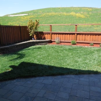 Boomerang - J.L's review (Backyard completed with stone wall in corner) - Masonry/Concrete Near Me
