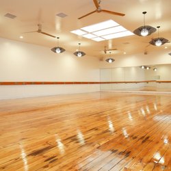 Ohana Yoga + Barre - Original hickory hardwoods, chic pendants and a gorgeous skylight make the studio space shine.