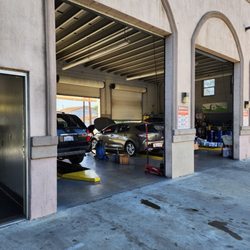 Brothers Express Lube - Paramount - My Toyota corolla hatchback being worked on and two other cars.