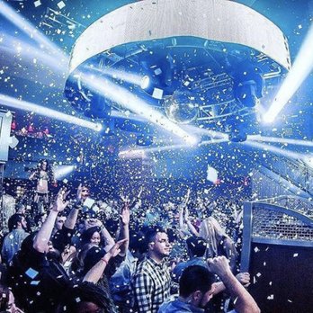 The Warehouse - a man standing on a stage surrounded by confetti - Performing Arts Near Me - Fairfield, Connecticut The Warehouse - a man standing on a stage surrounded by confetti - Performing Arts Near Me - Fairfield, Connecticut