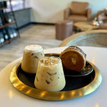 Haraz Coffee House - Iced Adeni + Iced Harazi Coffee + Hazelnut Brioche Supreme - Coffee & Tea Near Me - Fort Mill, South Carolina Haraz Coffee House - Iced Adeni + Iced Harazi Coffee + Hazelnut Brioche Supreme - Coffee & Tea Near Me - Fort Mill, South Carolina