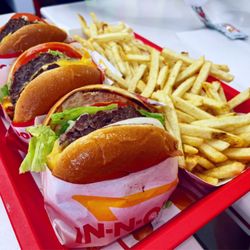 In-N-Out Burger - Cheeseburger (front) and double double cheeseburgers (back) with fries  IG: @fooddeclassified