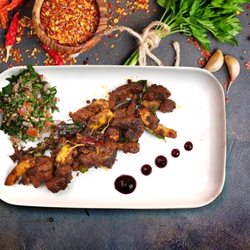 Koinonia - Pothu Ularthiyathu -  Bite-sized pieces of beef cooked with ginger, and shallots with authentic Keralan spices.