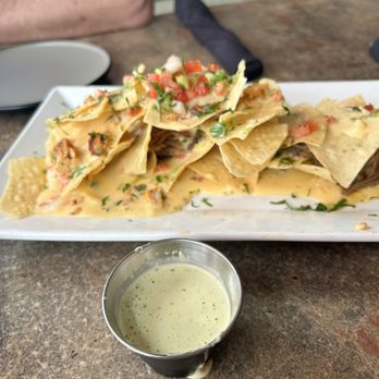 Riverhouse Houston - Nachos with very little meat. At $18 you would expect to see more than a couple of dabs of meat. - Golf Near Me - Houston, Texas Riverhouse Houston - Nachos with very little meat. At $18 you would expect to see more than a couple of dabs of meat. - Golf Near Me - Houston, Texas
