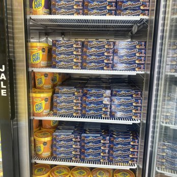 Ekeko Peruvian - Bombones small cubes of vanilla ice cream cover in chocolate come and get yours. - Convenience Stores Near Me - Houston, Texas
