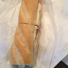 a sub sandwich on a piece of wax paper a sub sandwich on a piece of wax paper