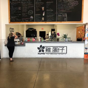 Kuma - a woman standing in front of a counter - Ice Cream & Frozen Yogurt Near Me - San Antonio, Texas