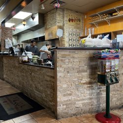 Mezza Mediterranean Grille - Baking fresh pita bread