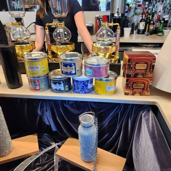 Hutch Cafe - a woman behind a counter with a variety of beverages - Cafes Near Me - Calgary, Alberta Hutch Cafe - a woman behind a counter with a variety of beverages - Cafes Near Me - Calgary, Alberta