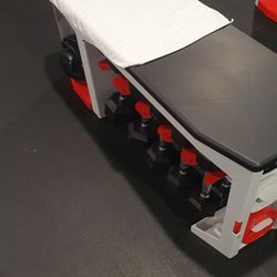 Rumble Boxing - The dumbbells and brass knuckles are under the bench.