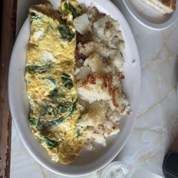 Feta and Spinach omelette with potatoes and "sourdough"