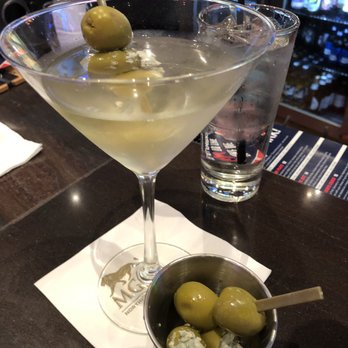 Center Stage - a martini with olives in a martini glass - Music Venues Near Me - Northfield, Ohio Center Stage - a martini with olives in a martini glass - Music Venues Near Me - Northfield, Ohio