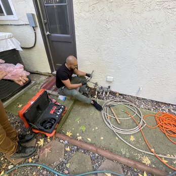 Local Drain Cleaning Specialists - Mike hard at work capping water line causing leak. - Plumbing Near Me
