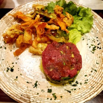 Osteria del Borgo - Steak tartare accompanied by lightly fried vegetable strips. - Italian Near Me - Florence, FI
