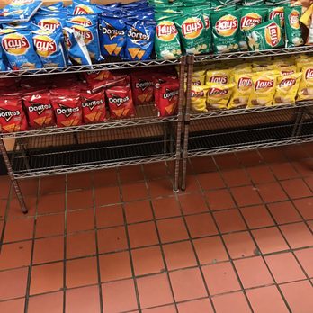Blimpie - a display of chips and chips in a grocery store - Sandwiches Near Me - East Meadow, New York